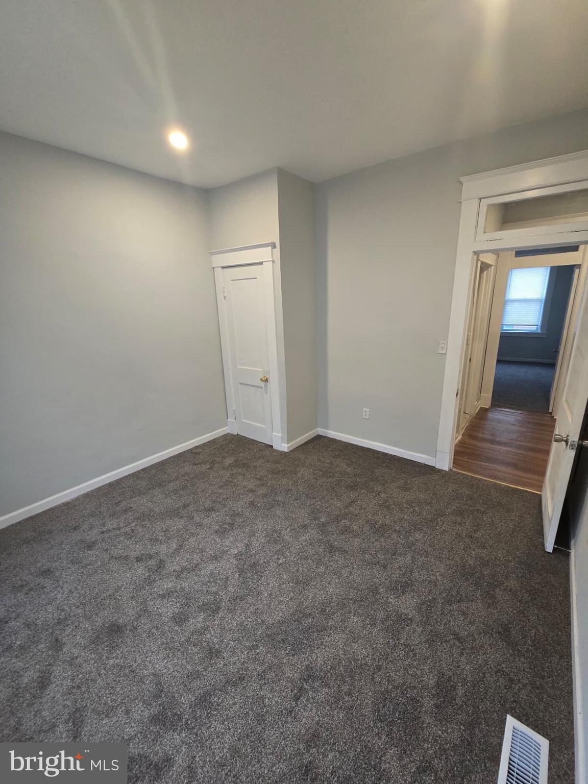 2430 Reisterstown Road Baltimore, MD 21217 - Photo 25 of 40 an empty room with staircase and mirror