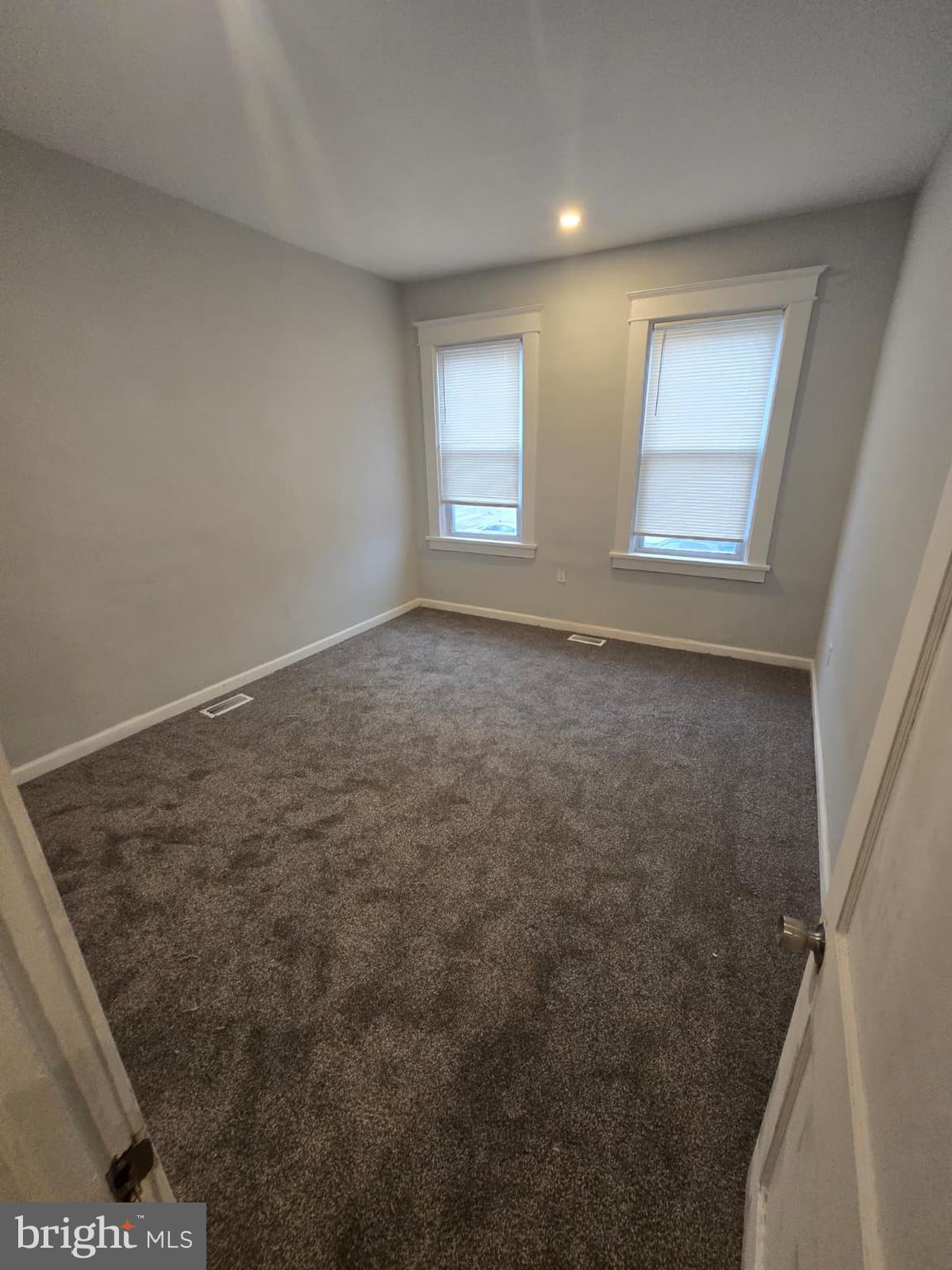 2430 Reisterstown Road Baltimore, MD 21217 - Photo 27 of 40 an empty room with windows