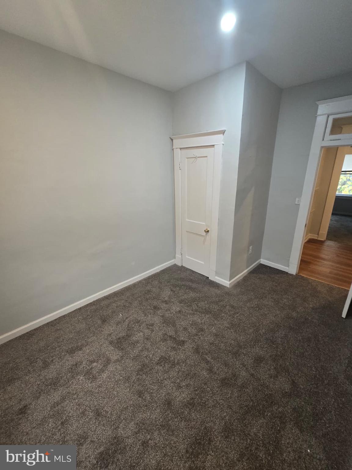 2430 Reisterstown Road Baltimore, MD 21217 - Photo 28 of 40 an empty room with wooden floor