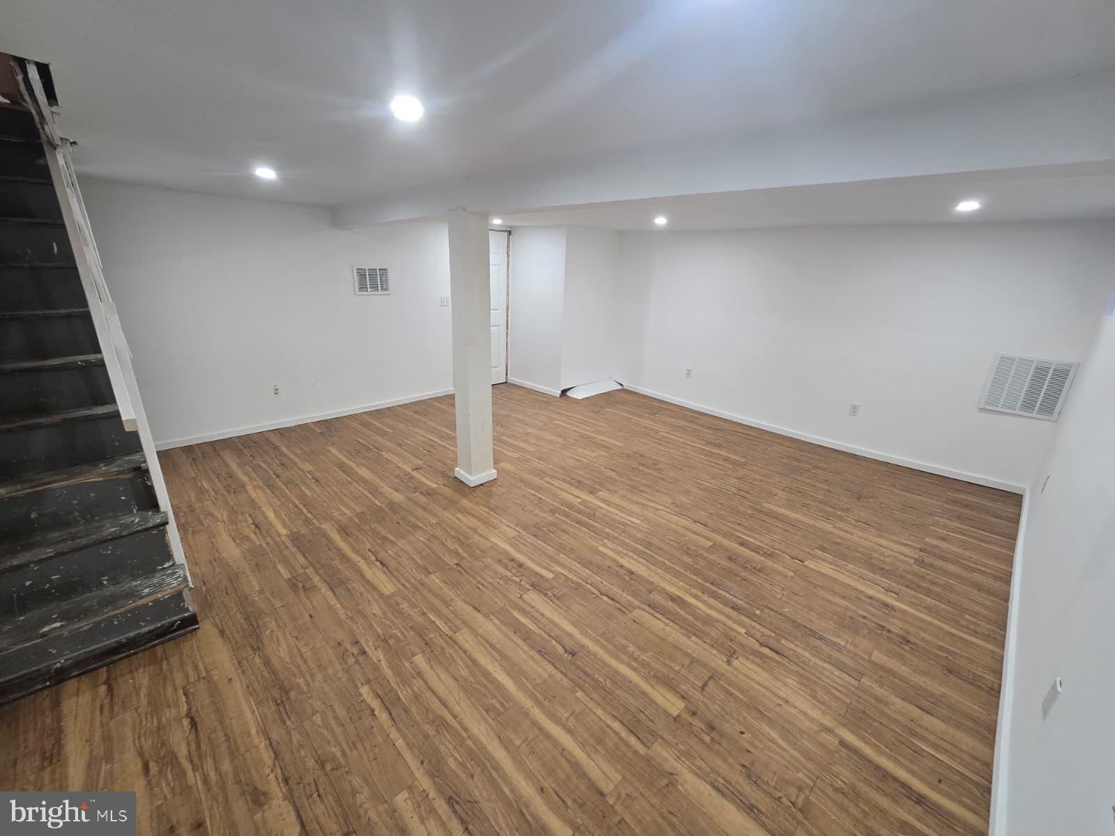 2430 Reisterstown Road Baltimore, MD 21217 - Photo 33 of 40 a view of an empty room with wooden floor