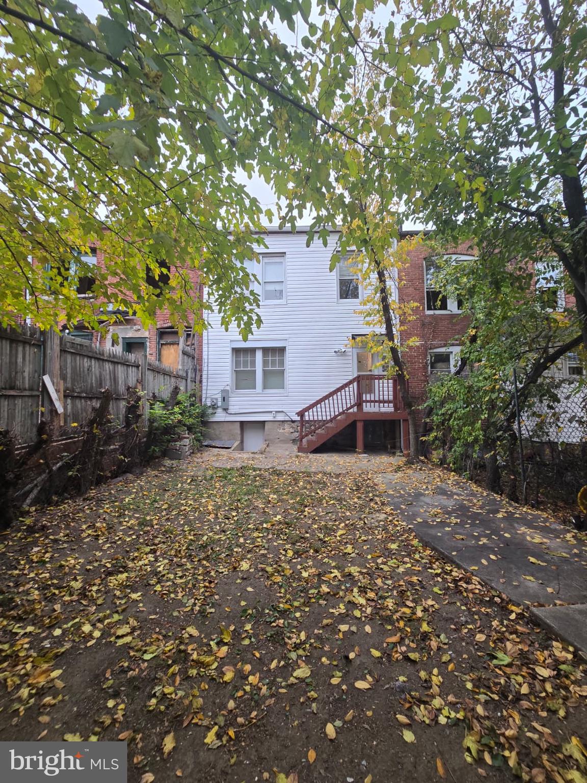 2430 Reisterstown Road Baltimore, MD 21217 - Photo 38 of 40 a house with trees in front of it