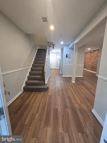 a view of entryway with wooden floor