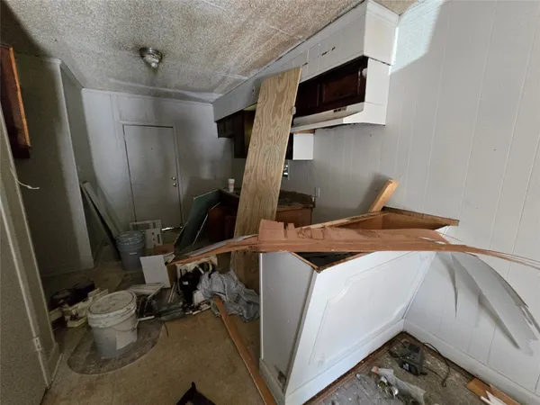 a bedroom with a bed and flat screen tv