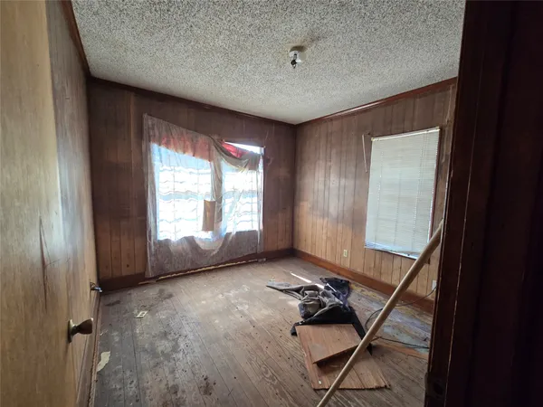 a view of a room with gym equipment and windows