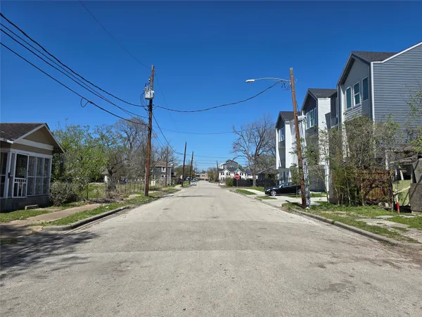 a view of a city street lined with tall buildings