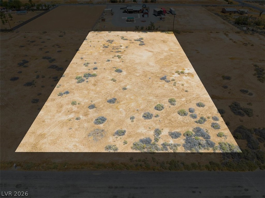 4580 Lawrence Road Pahrump, NV 89048 - Photo 30 of 40 A spacious, undeveloped desert lot awaits your vision, perfect for building a custom home.