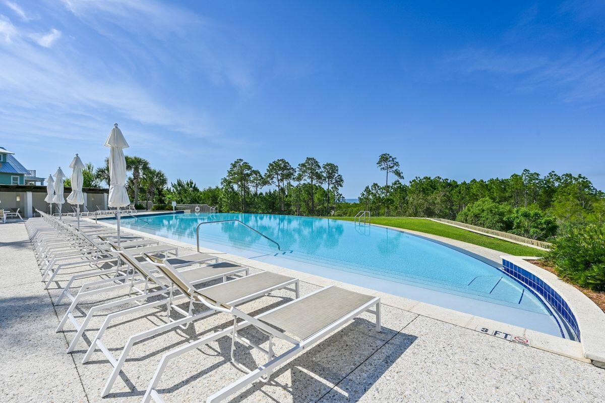 Lot 87 Cypress Drive Santa Rosa Beach, FL 32459 - Photo 1 of 39 a view of a swimming pool with a yard