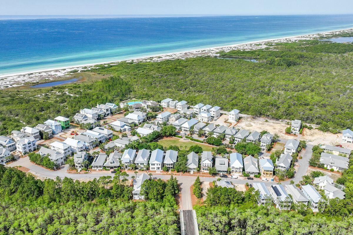 Lot 87 Cypress Drive Santa Rosa Beach, FL 32459 - Photo 23 of 39 a view of an ocean with a building in the background