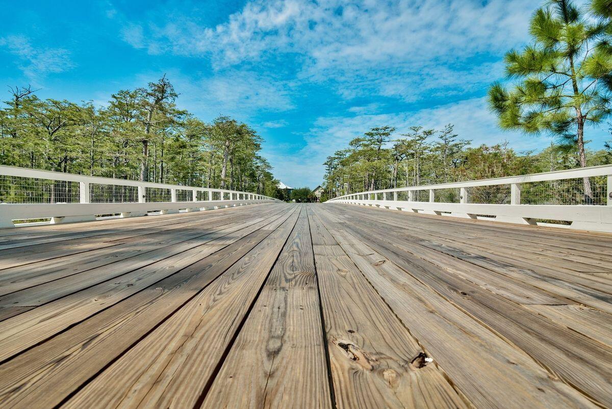 Lot 87 Cypress Drive Santa Rosa Beach, FL 32459 - Photo 28 of 39 a view of a balcony with wooden floor and plants