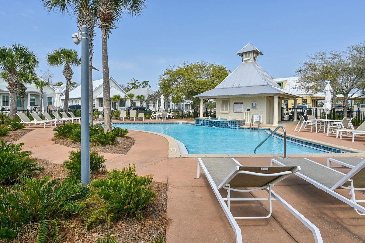 Lot 87 Cypress Drive Santa Rosa Beach, FL 32459 - Photo 38 of 39 a view of a patio with a table and chairs