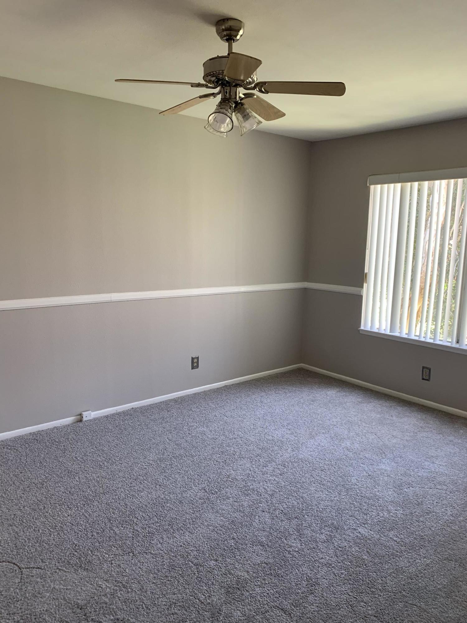 1778 Sinaloa Road, Unit 298 Simi Valley, CA 93065 - Photo 20 of 43 a view of a livingroom with a ceiling fan and window