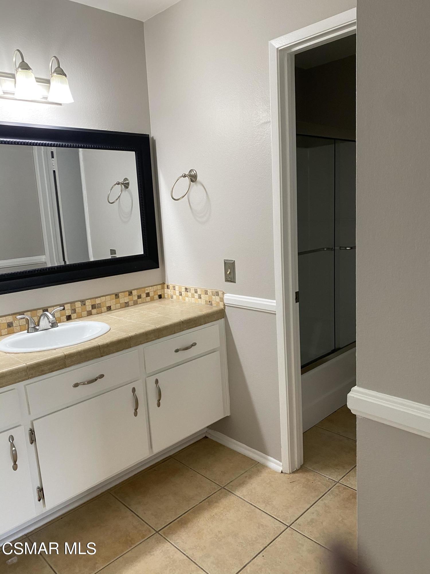 1778 Sinaloa Road, Unit 298 Simi Valley, CA 93065 - Photo 29 of 43 a bathroom with a sink and a mirror