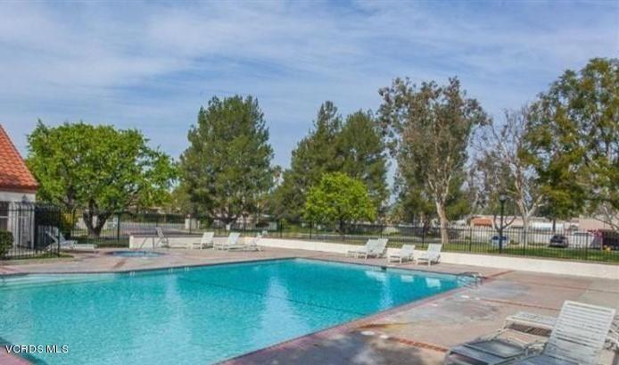 1778 Sinaloa Road, Unit 298 Simi Valley, CA 93065 - Photo 34 of 43 a view of a swimming pool with an outdoor space and seating area