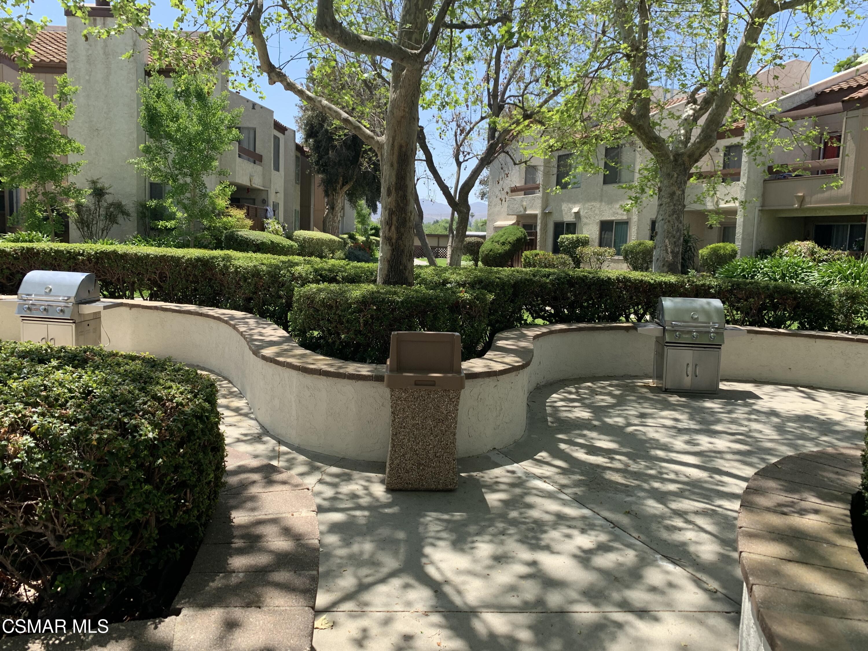 1778 Sinaloa Road, Unit 298 Simi Valley, CA 93065 - Photo 40 of 43 a view of a backyard with plants and tree