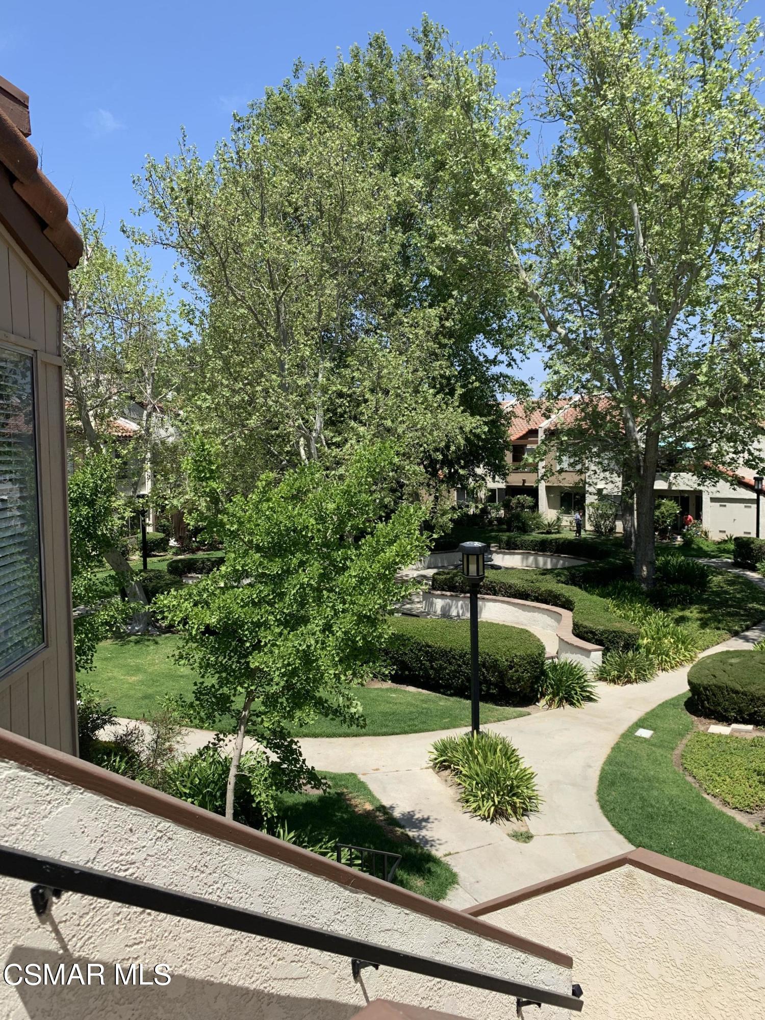 1778 Sinaloa Road, Unit 298 Simi Valley, CA 93065 - Photo 6 of 43 a view of a garden with a bench in the background