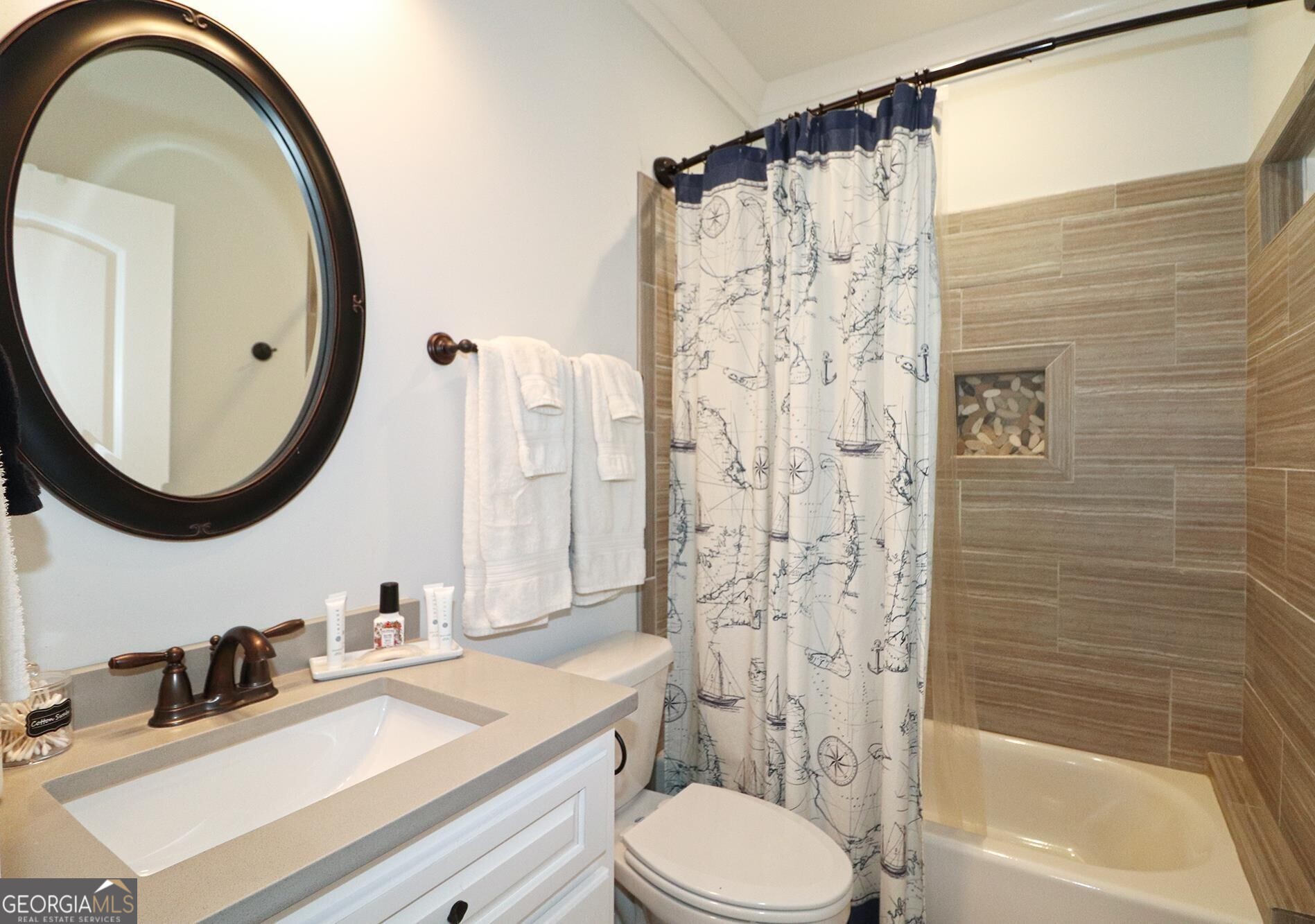 1603 Boutwell Road Perry, GA 31069 - Photo 23 of 96 a bathroom with a sink a toilet and a mirror