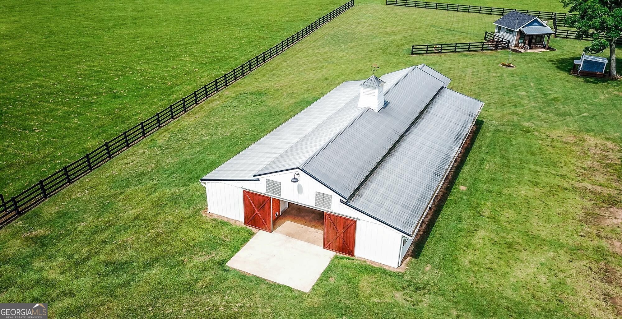 1603 Boutwell Road Perry, GA 31069 - Photo 27 of 96 A stunning white barn serves as a versatile event and gathering space.