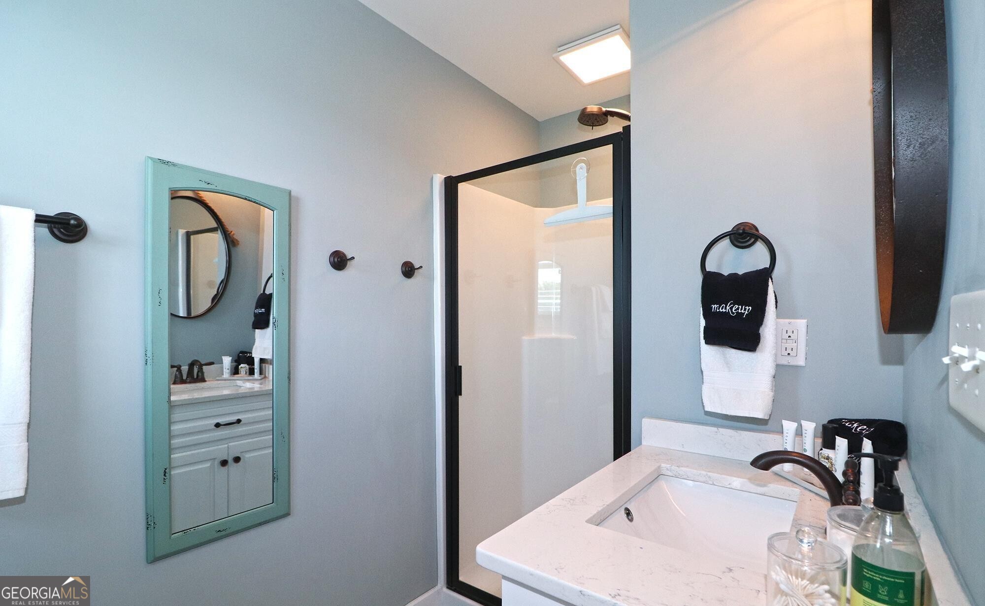 1603 Boutwell Road Perry, GA 31069 - Photo 40 of 96 a bathroom with a granite countertop sink and a mirror