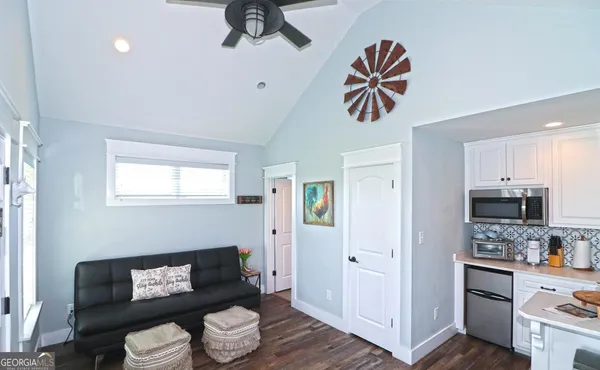 a room with a flat screen tv and a fireplace