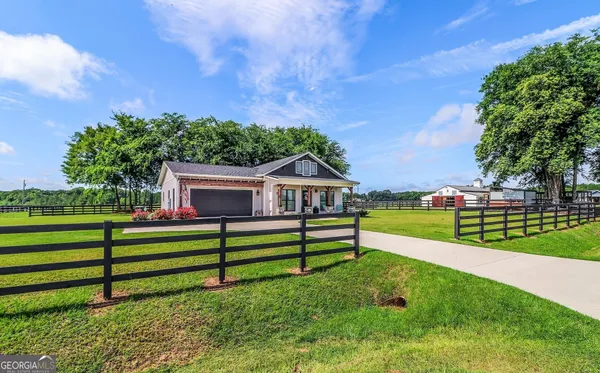 a kitchen with a stove a sink and a refrigerator