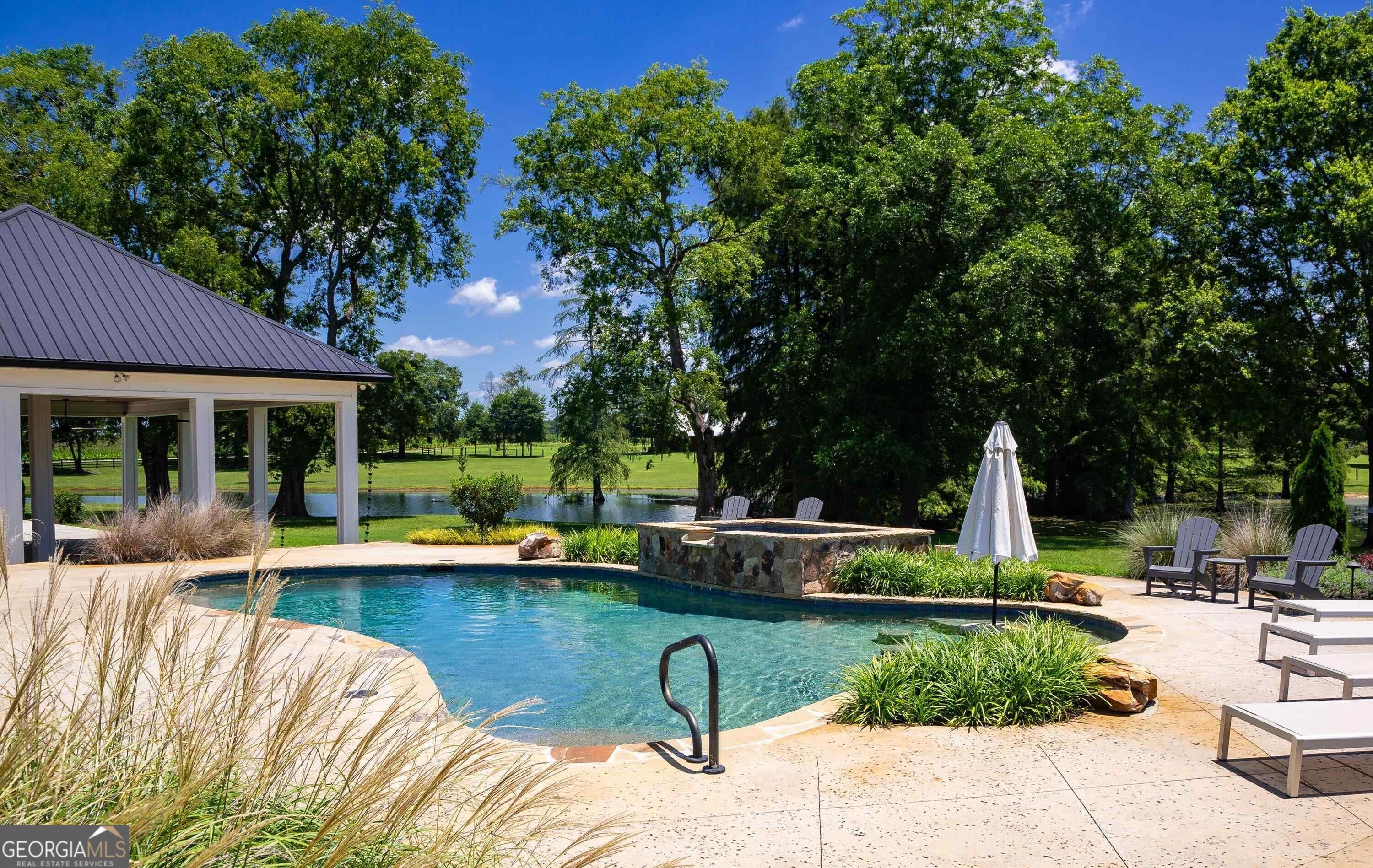 1603 Boutwell Road Perry, GA 31069 - Photo 63 of 93 Designed for relaxation and entertainment, the pool enhances guest enjoyment.