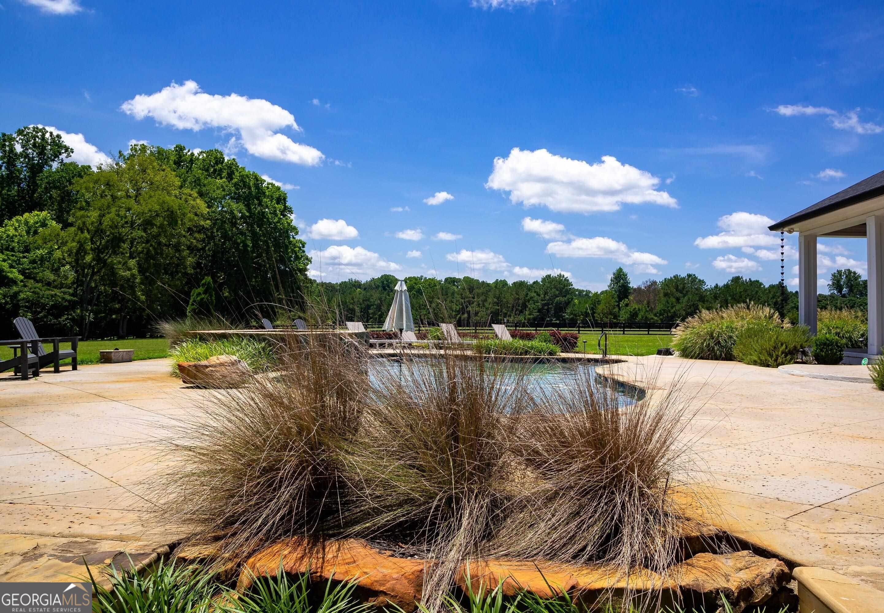 1603 Boutwell Road Perry, GA 31069 - Photo 63 of 96 a view of a lake with a house in the background