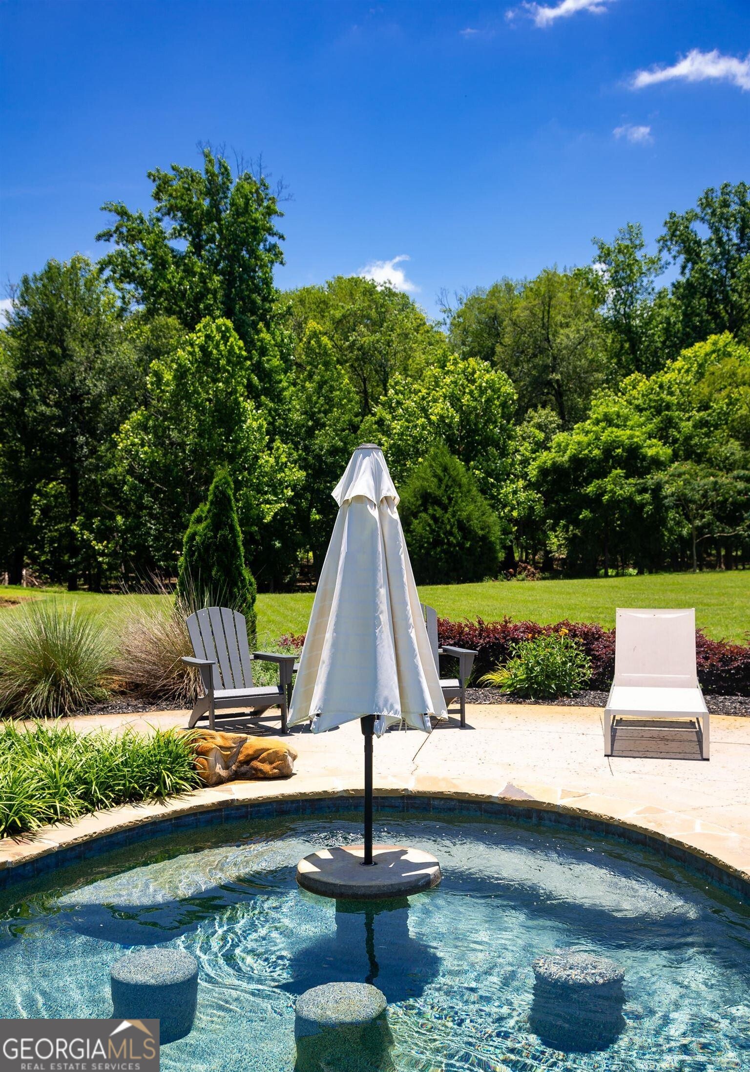 1603 Boutwell Road Perry, GA 31069 - Photo 72 of 96 a view of a lake with couches and wooden fence