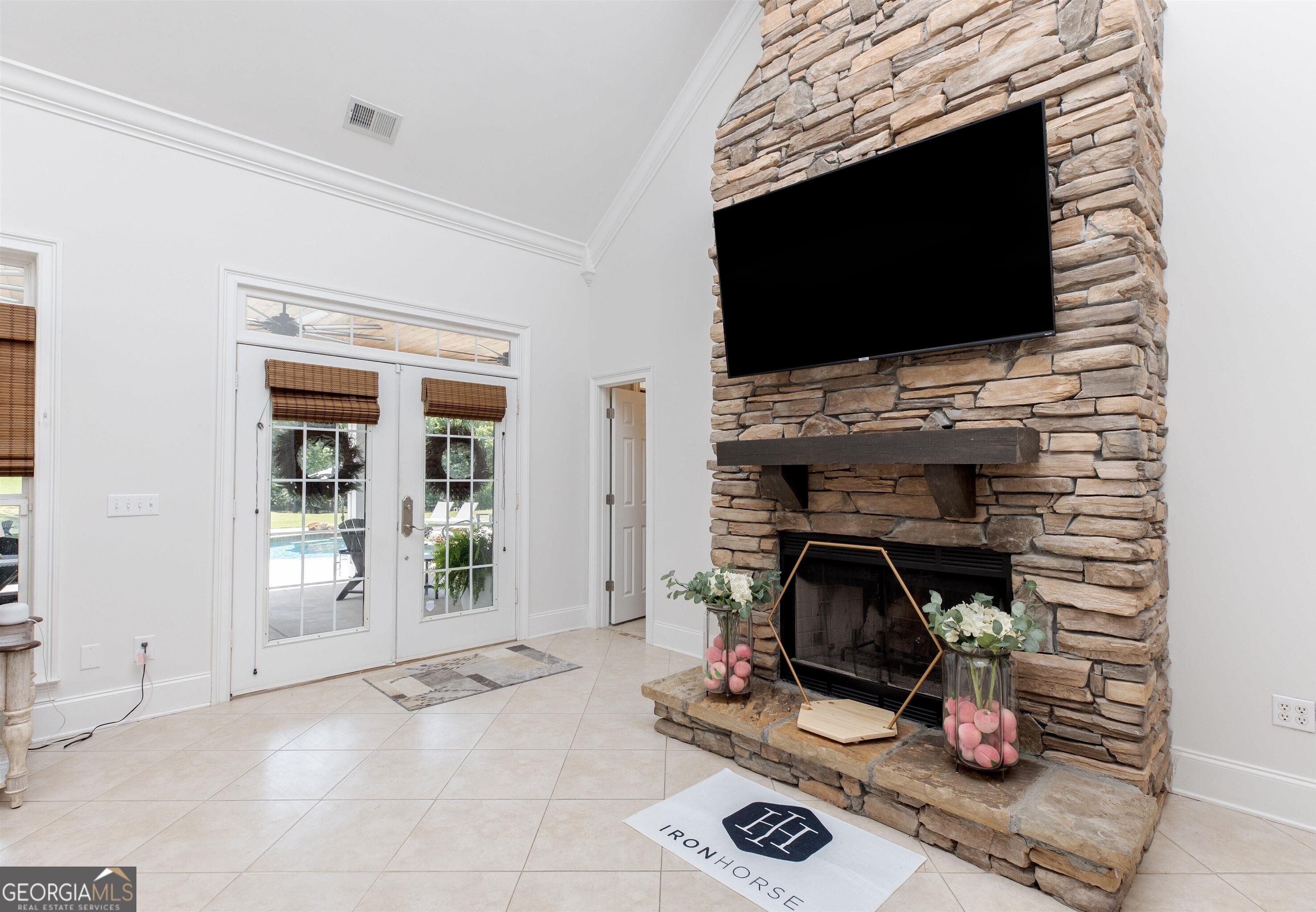 1603 Boutwell Road Perry, GA 31069 - Photo 82 of 96 a room with a flat screen tv and a fireplace