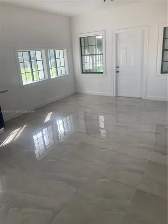 a view of an empty room and window