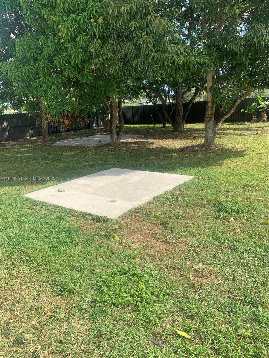 30900 Southwest 189th Avenue, Unit 2 Homestead, FL 33030 - Photo 6 of 7 a view of a yard