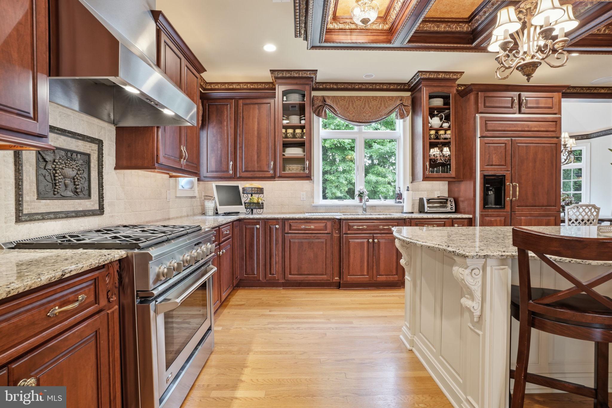 1588 Wrightstown Road Newtown, PA 18940 - Photo 28 of 81 a kitchen with stainless steel appliances granite countertop a stove a sink and a refrigerator