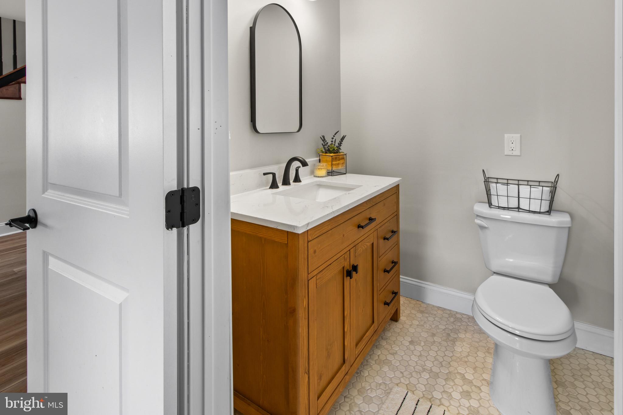 529 Ridge Road Southampton, NJ 08088 - Photo 12 of 25 a bathroom with a toilet sink and mirror