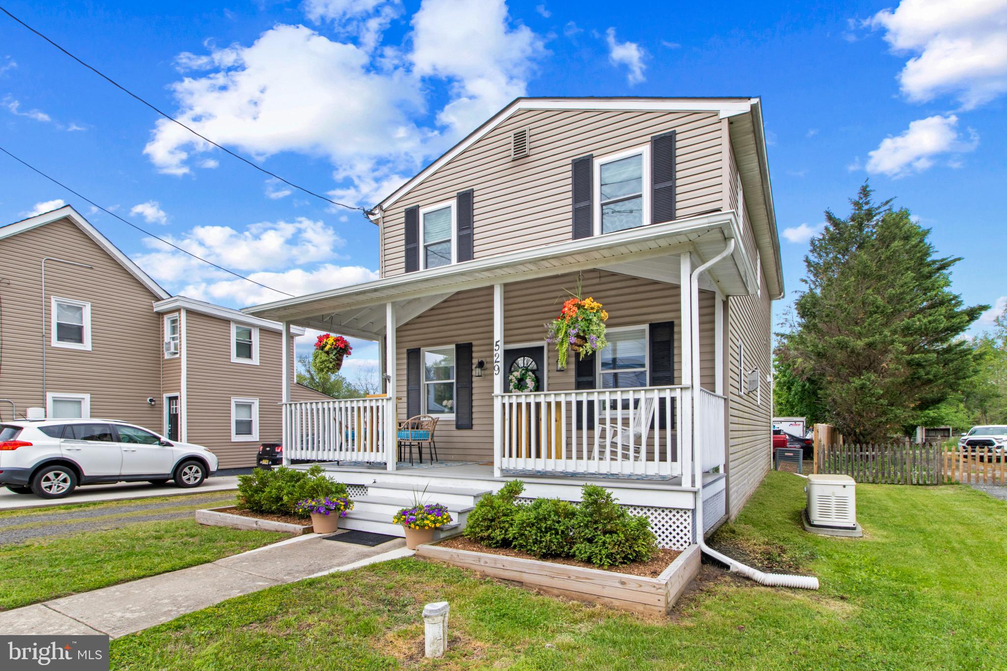 529 Ridge Road Southampton, NJ 08088 - Photo 3 of 25 a front view of a house with a yard table and chairs