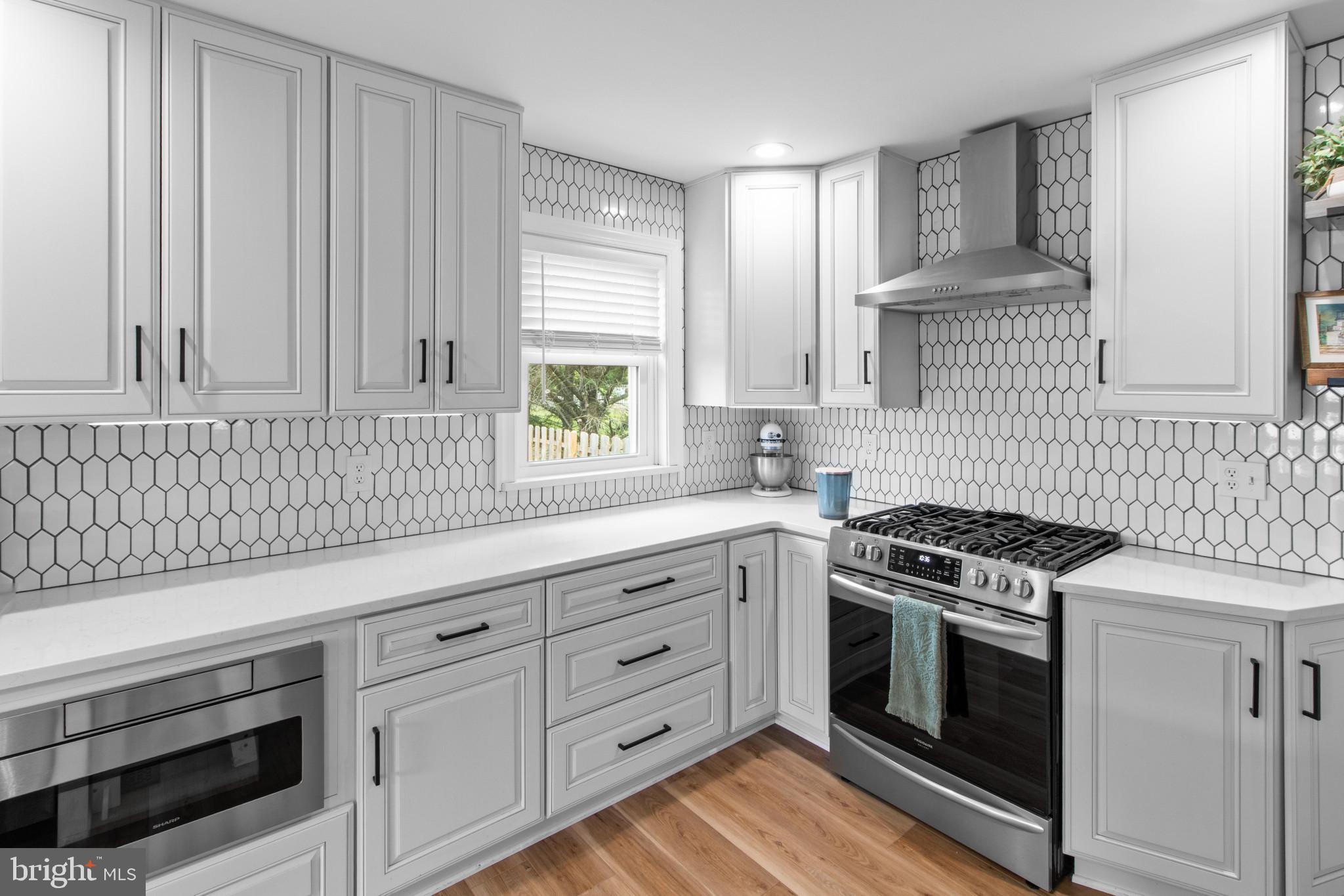 529 Ridge Road Southampton, NJ 08088 - Photo 10 of 25 a kitchen with granite countertop white cabinets and white appliances