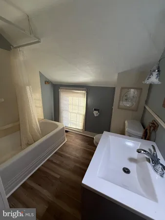 a bathroom with a sink and mirror