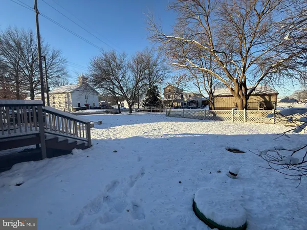 a view of outdoor space with wooden fence