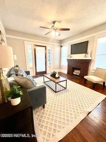 a living room with furniture and a fireplace