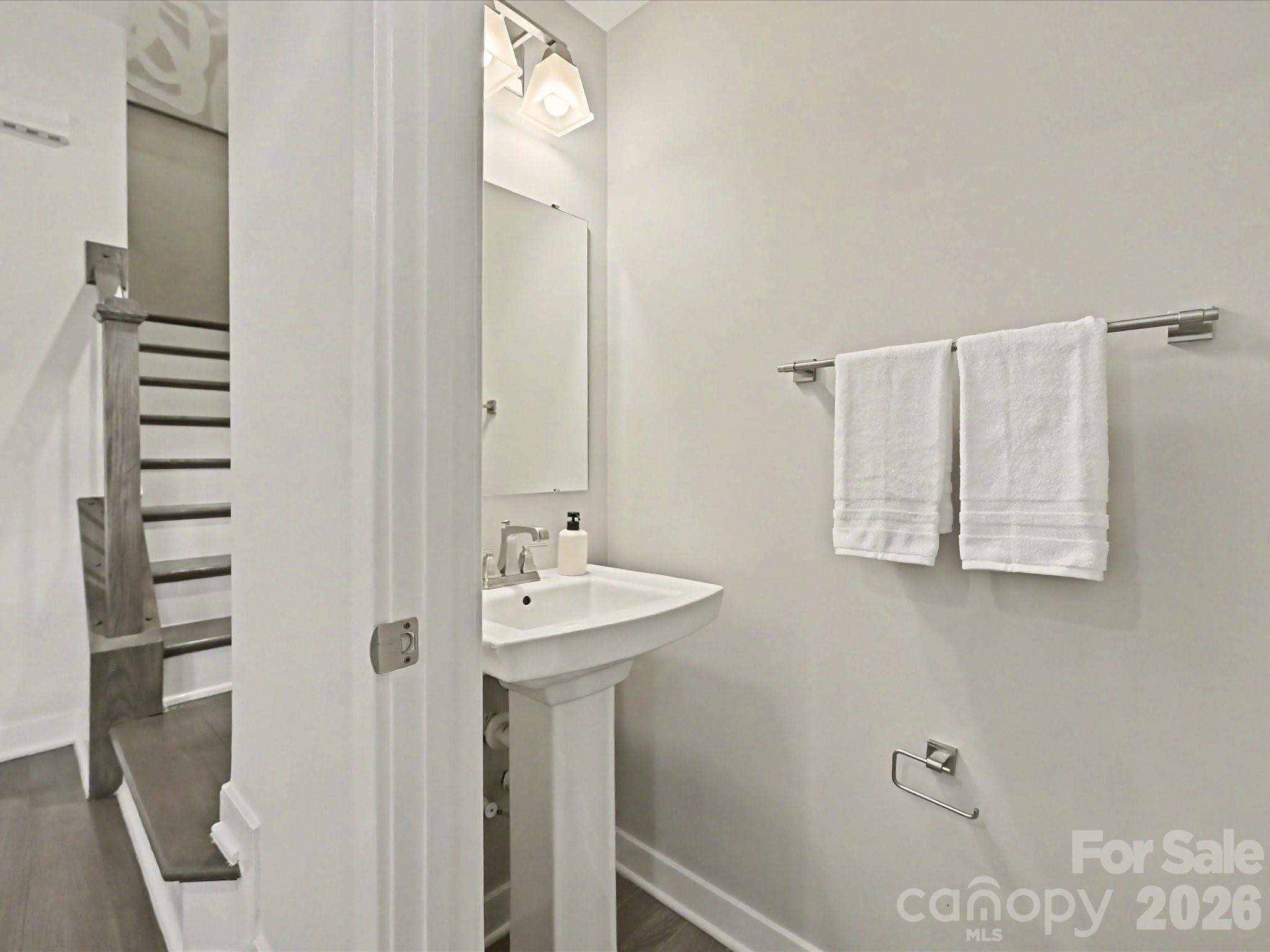 653 Uwharrie River Road Charlotte, NC 28211 - Photo 13 of 29 a bathroom with a sink and mirror