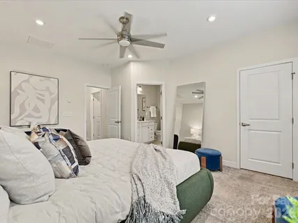 a bathroom with a double vanity sink toilet and a mirror