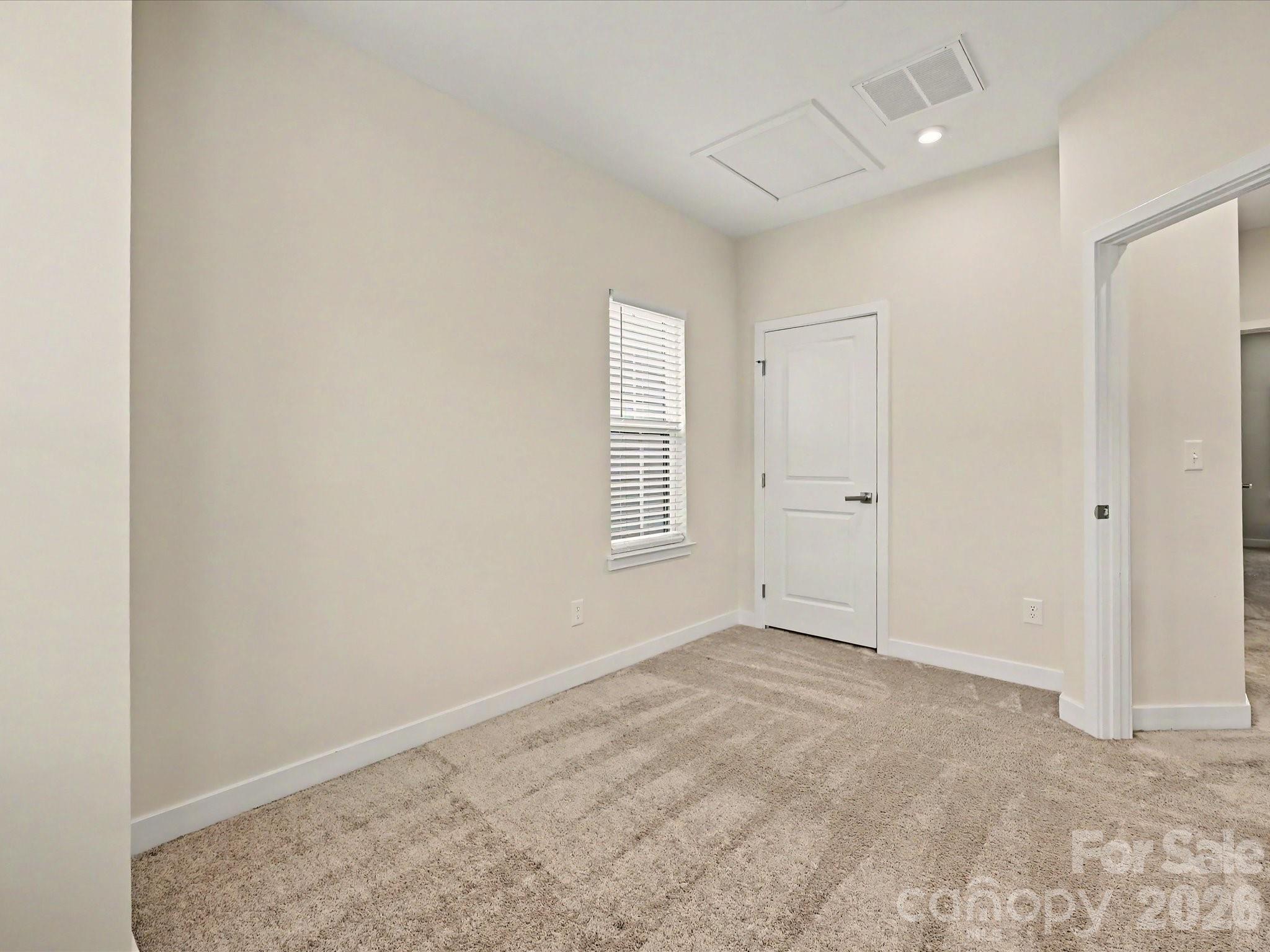 653 Uwharrie River Road Charlotte, NC 28211 - Photo 22 of 29 an empty room with windows and closet