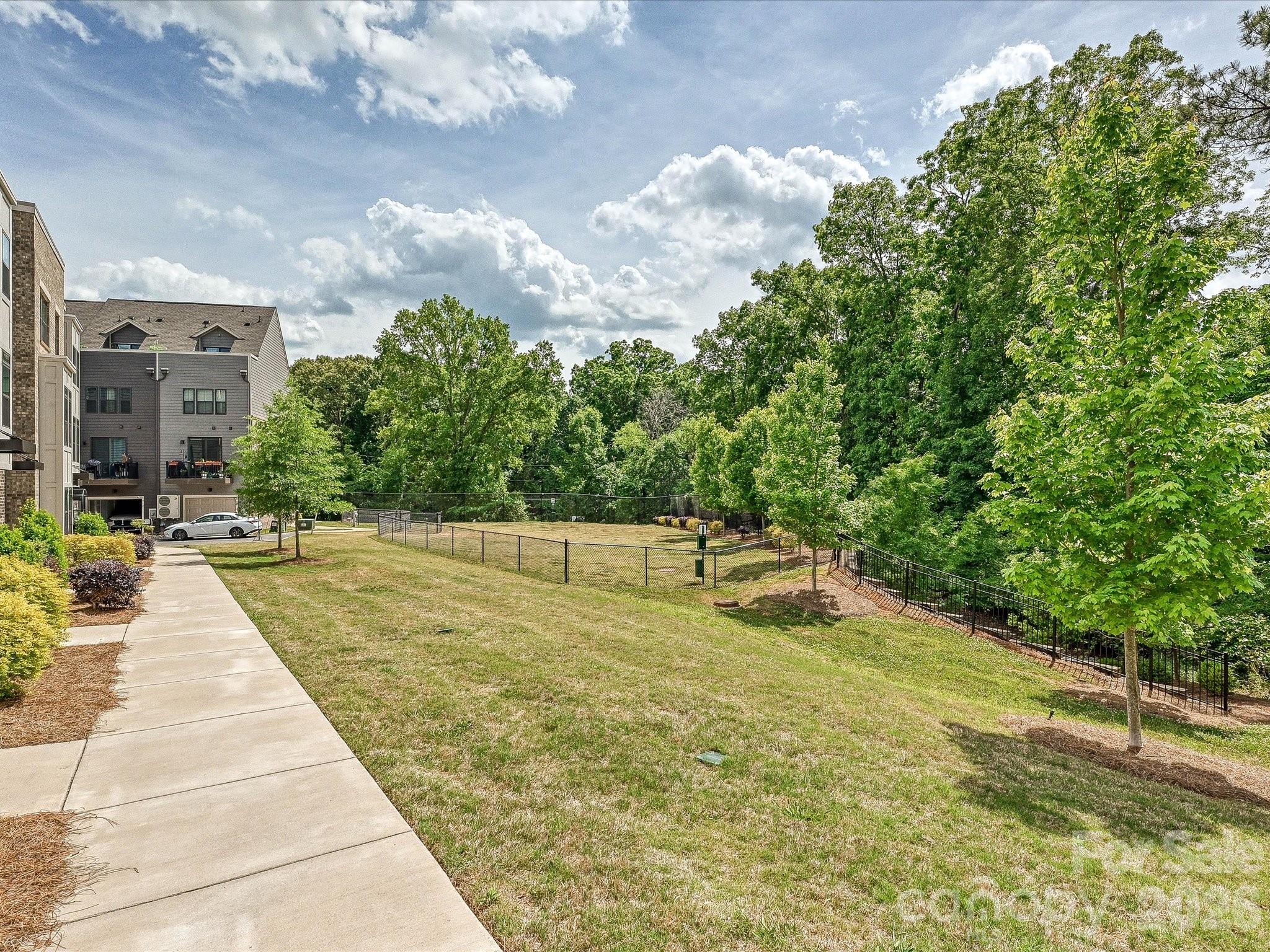 653 Uwharrie River Road Charlotte, NC 28211 - Photo 27 of 29 a swimming pool with trees in the background