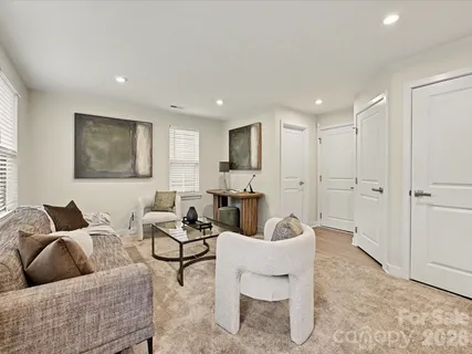 a living room with furniture and a rug