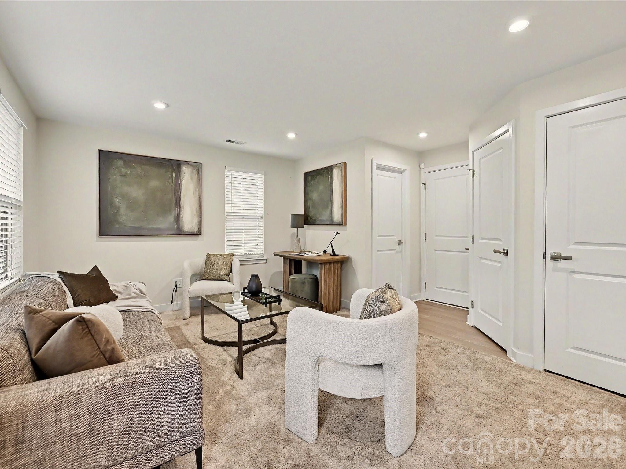 653 Uwharrie River Road Charlotte, NC 28211 - Photo 3 of 29 a living room with furniture and a rug