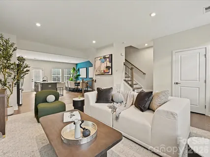 a living room with furniture and a couches