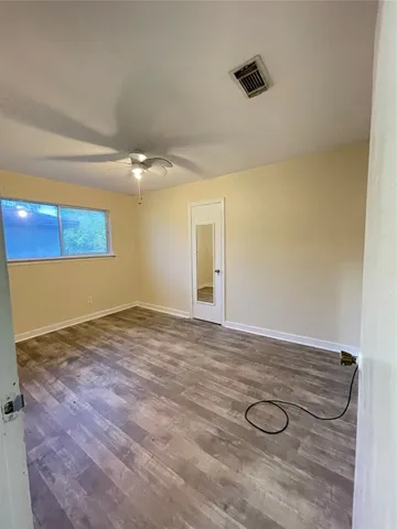 a view of a livingroom with wooden floor