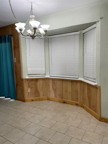 a view of a room with wooden walls