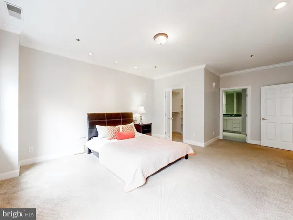 a bedroom with a bed and closet