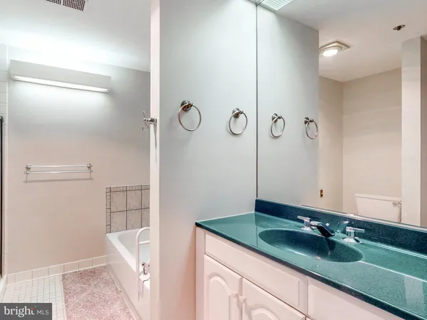 a bathroom with a sink and mirror