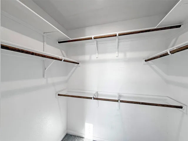 a bathroom with a double vanity sink and mirror