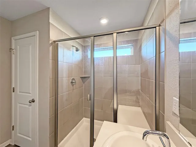 a bathroom with a sink toilet and a mirror